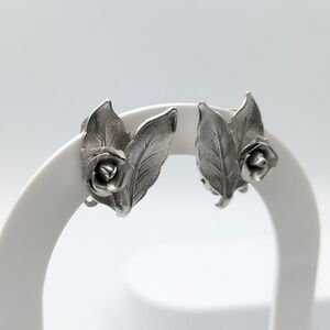 Vintage signed Continental silver tone flower clip on earrings